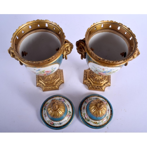 299 - A PAIR OF 19TH CENTURY FRENCH SEVRES PORCELAIN VASES AND COVERS with gilt bronze fittings. 29 cm x 1... 