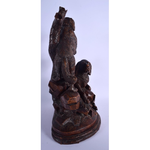 301 - A LARGE 19TH CENTURY BAVARIAN BLACK FOREST CARVED WOOD FIGURAL GROUP modelled as two hounds upon a r... 