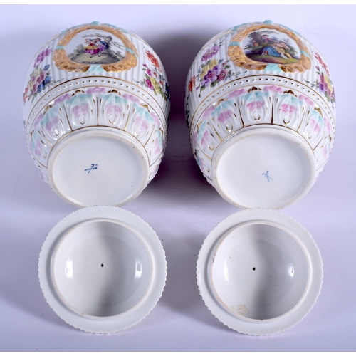 55 - A LARGE PAIR OF EARLY 20TH CENTURY DRESDEN PORCELAIN VASES AND COVERS Meissen style, painted with fl... 