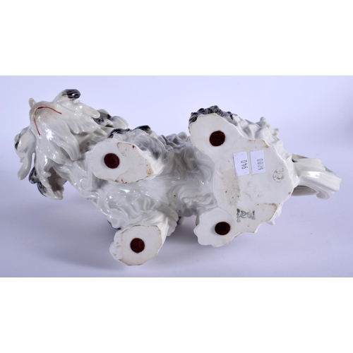 59 - AN EARLY 20TH CENTURY GERMAN DRESDEN PORCELAIN FIGURE OF A DOG modelled as a bolognese dog. 26 cm x ... 