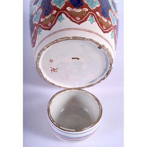 63 - AN 18TH/19TH CENTURY DUTCH DELFT FAIENCE GLAZED JAR AND COVER painted with birds and flowers. 24 cm ... 
