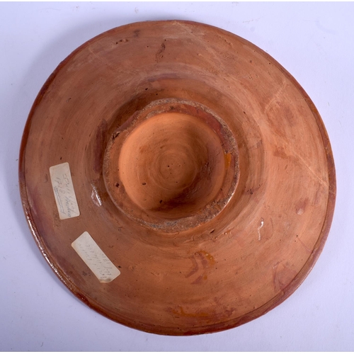64 - AN 18TH CENTURY DUTCH POTTERY SLIP DECORATED BOWL painted with a green circle. 24 diameter.