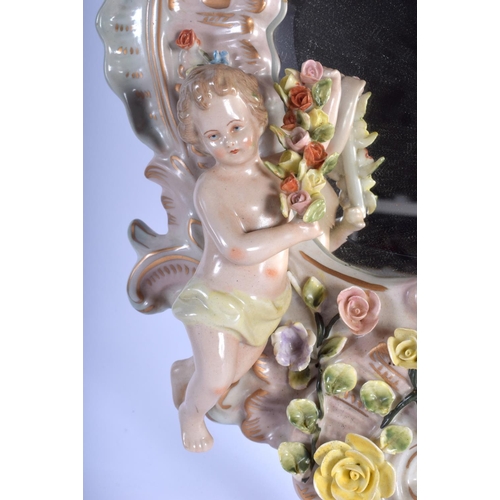 69 - A CONTINENTAL PORCELAIN WALL BRACKET together with a mirror. 46 cm & 34 cm long. (2)