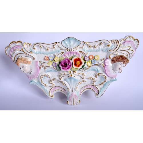 69 - A CONTINENTAL PORCELAIN WALL BRACKET together with a mirror. 46 cm & 34 cm long. (2)
