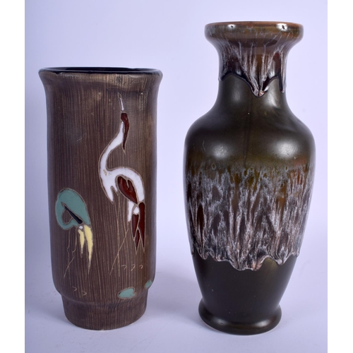 77 - A 1960S GERMAN RETRO POTTERY VASE together with another retro vase. Largest 26 cm high. (2)