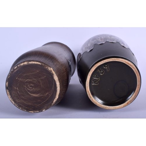 77 - A 1960S GERMAN RETRO POTTERY VASE together with another retro vase. Largest 26 cm high. (2)