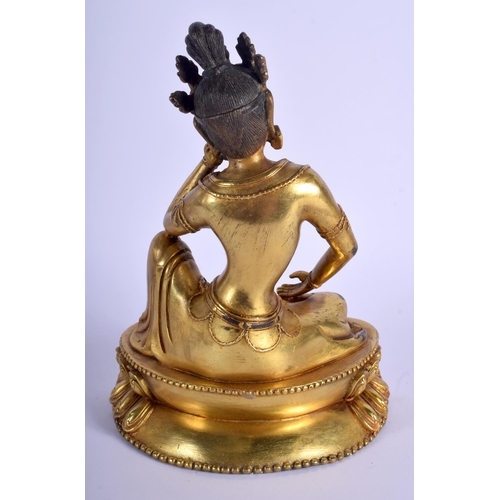 1011 - A CHINESE GILT BRONZE FIGURE OF A SEATED BUDDHA 20th Century, modelled upon a triangular base. 22 cm... 