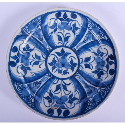 102 - AN 18TH CENTURY DELFT BLUE AND WHITE POTTERY DISH painted with flowers. 23 cm diameter.