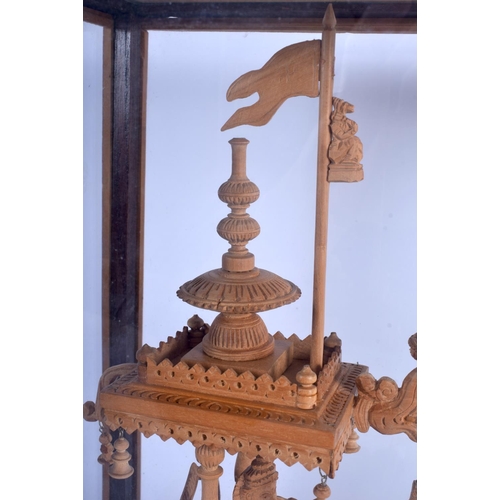 1023 - A 1950S SOUTH EAST ASIAN CARVED SANDALWOOD FIGURE OF A CART modelled with attendants. Figure 37 cm x... 