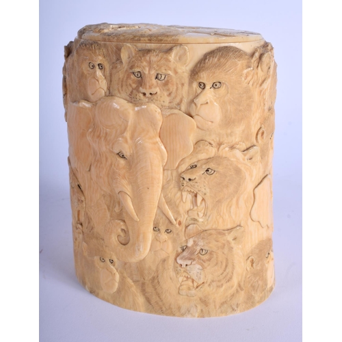 1040 - A 19TH CENTURY JAPANESE MEIJI PERIOD CARVED IVORY TUSK VASE AND COVER decorated with monkeys and ele... 