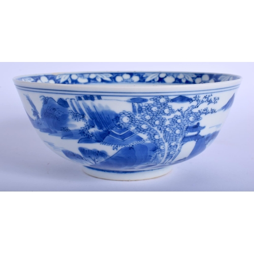 1042 - A 19TH CENTURY CHINESE BLUE AND WHITE PORCELAIN BOWL bearing Kangxi marks to base, painted with land... 