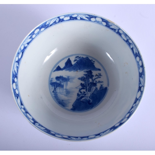 1042 - A 19TH CENTURY CHINESE BLUE AND WHITE PORCELAIN BOWL bearing Kangxi marks to base, painted with land... 