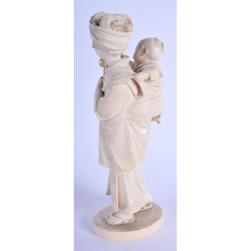 1043 - A 19TH CENTURY JAPANESE MEIJI PERIOD CARVED IVORY OKIMONO modelled as a female roaming with a child ... 