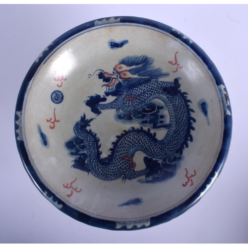 1051 - A CHINESE IRON RED BLUE AND WHITE PORCELAIN DRAGON TAZZA 20th Century, and an armorial plate. Larges... 