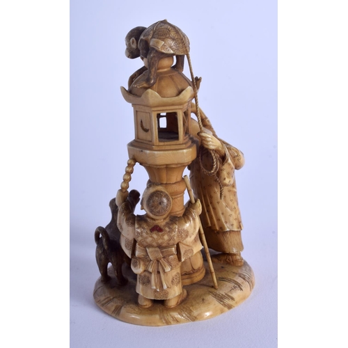 1062 - A 19TH CENTURY JAPANESE MEIJI PERIOD CARVED IVORY OKIMONO modelled as two figures beside a hound & a... 