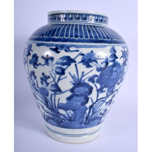 1070 - AN 18TH CENTURY JAPANESE EDO PERIOD ARITA BLUE AND WHITE VASE painted with foliage and vines. 26 cm ... 