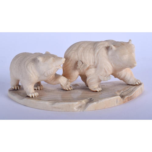 1073 - A 19TH CENTURY JAPANESE MEIJI PERIOD CARVED IVORY OKIMONO modelled with two roaming bears. 13 cm x 6... 