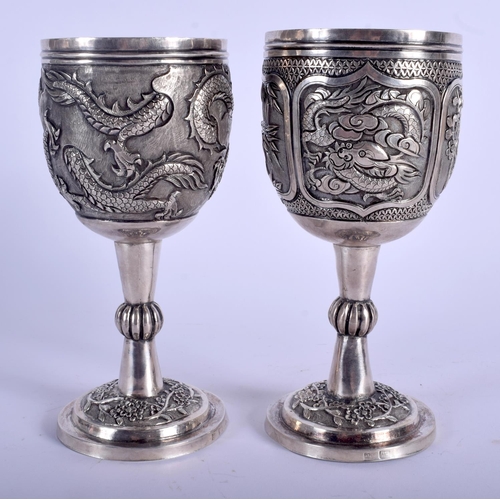 1078 - A FINE PAIR OF 19TH CENTURY CHINESE EXPORT SILVER GOBLETS by Wang Hing, decorated with dragons and f... 