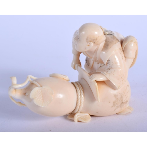 1080 - A 19TH CENTURY JAPANESE MEIJI PERIOD CARVED IVORY OKIMONO modelled seated upon a vegetable. 10 cm x ... 