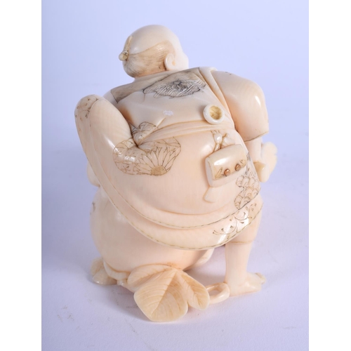 1080 - A 19TH CENTURY JAPANESE MEIJI PERIOD CARVED IVORY OKIMONO modelled seated upon a vegetable. 10 cm x ... 