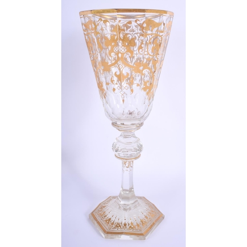 11 - A LARGE 19TH CENTURY BOHEMIAN GILT DECORATED GLASS GOBLET highlighted with scrolling vines. 28.5 cm ... 