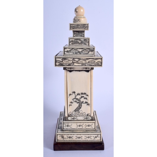 1100 - A 19TH CENTURY JAPANESE MEIJI PERIOD CARVED IVORY PAGODA inset with a seated buddha. 24 cm x 9 cm.