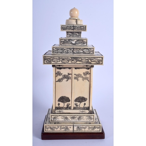 1100 - A 19TH CENTURY JAPANESE MEIJI PERIOD CARVED IVORY PAGODA inset with a seated buddha. 24 cm x 9 cm.