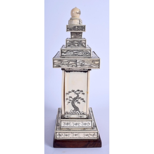 1100 - A 19TH CENTURY JAPANESE MEIJI PERIOD CARVED IVORY PAGODA inset with a seated buddha. 24 cm x 9 cm.