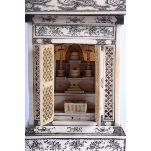 1100 - A 19TH CENTURY JAPANESE MEIJI PERIOD CARVED IVORY PAGODA inset with a seated buddha. 24 cm x 9 cm.