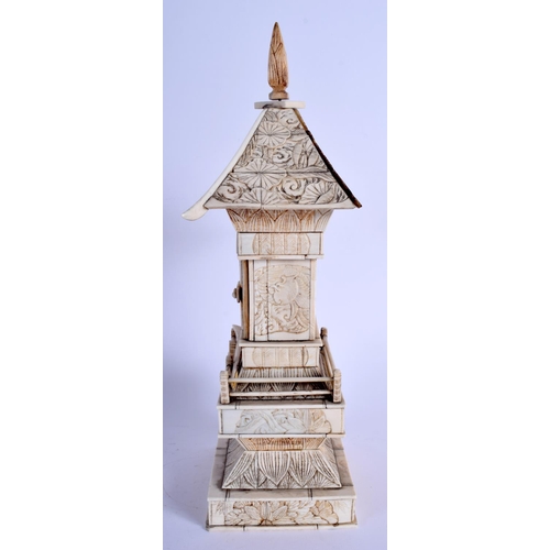 1101 - A 19TH CENTURY JAPANESE MEIJI PERIOD CARVED IVORY PAGODA inset with a seated buddha. 30 cm x 8 cm.