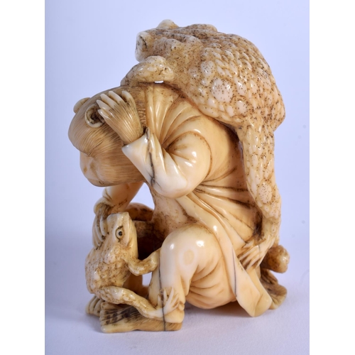 1102 - A 19TH CENTURY JAPANESE MEIJI PERIOD CARVED IVORY OKIMONO modelled as a monkey holding frogs. 7 cm x... 