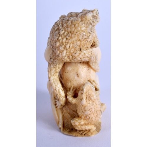 1102 - A 19TH CENTURY JAPANESE MEIJI PERIOD CARVED IVORY OKIMONO modelled as a monkey holding frogs. 7 cm x... 