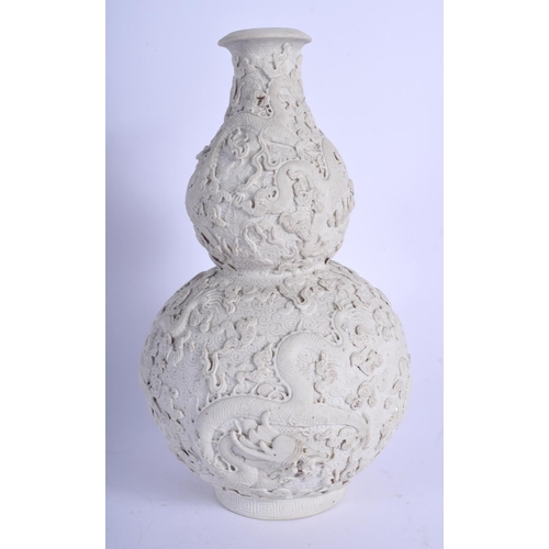 1103 - A 19TH CENTURY CHINSE BLANC DE CHINE PORCELAIN VASE bearing Qianlong marks to base, decorated with d... 