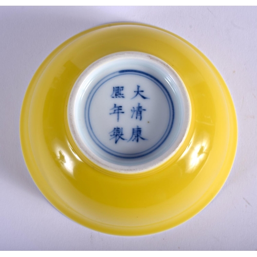 1113 - A CHINESE YELLOW GROUND PORCELAIN BOWL 20th Century, bearing Kangxi marks to base. 11 cm diameter.