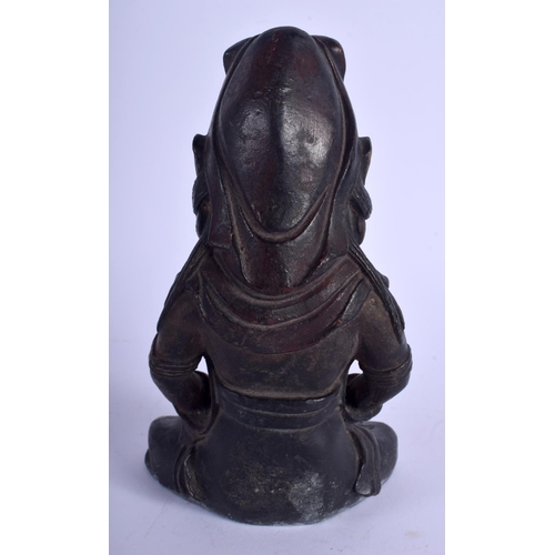 1119 - A CHINESE BRONZE FIGURE OF A SEATED BUDDHISTIC DEITY 20th Century, modelled holding a teapot. 19 cm ... 