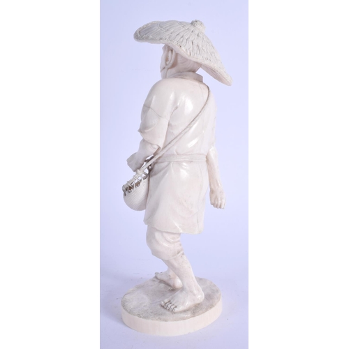 1124 - A 19TH CENTURY JAPANESE MEIJI PERIOD CARVED IVORY OKIMONO modelled as a roaming male holding a baske... 