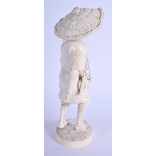 1124 - A 19TH CENTURY JAPANESE MEIJI PERIOD CARVED IVORY OKIMONO modelled as a roaming male holding a baske... 