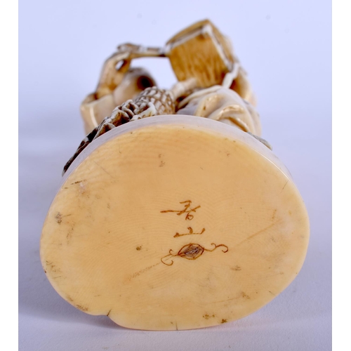 1125 - A 19TH CENTURY JAPANESE MEIJI PERIOD CARVED IVORY OKIMONO modelled as a male holding a lantern. 20 c... 