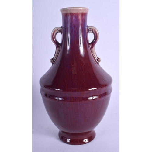 1127 - AN EARLY 20TH CENTURY CHINESE TWIN HANDLED FLAMBE VASE Late Qing, with drip glazed decoration. 24 cm... 