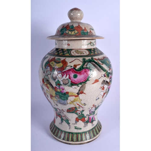 1134 - A LARGE 19TH CENTURY CHINESE FAMILLE VERTE VASE AND COVER of crackle glazed form. 45 cm x 21 cm.