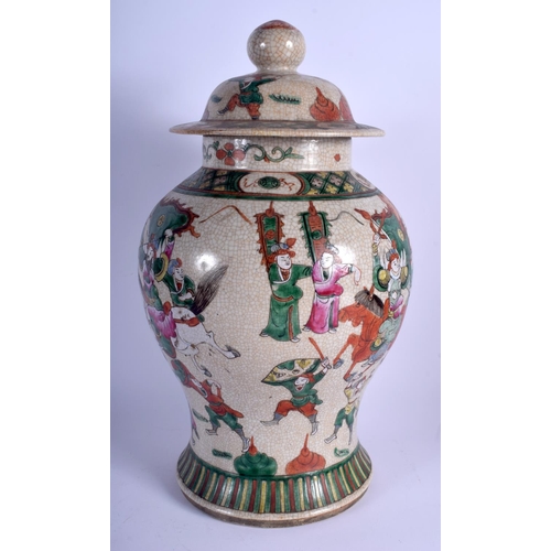 1134 - A LARGE 19TH CENTURY CHINESE FAMILLE VERTE VASE AND COVER of crackle glazed form. 45 cm x 21 cm.