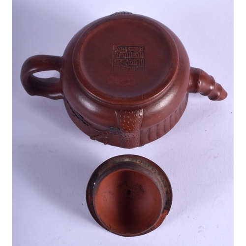 1144 - AN EARLY 20TH CENTURY CHINESE YIXING TEAPOT AND COVER overlaid with pine trees and vines. 15 cm wide... 