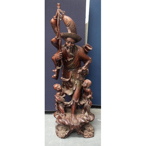 1148 - A VERY LARGE 19TH CENTURY CHINESE HARDWOOD FIGURE OF A FISHERMAN Qing, of monumental proportions. 86... 