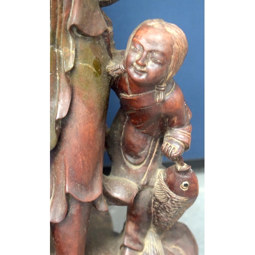 1148 - A VERY LARGE 19TH CENTURY CHINESE HARDWOOD FIGURE OF A FISHERMAN Qing, of monumental proportions. 86... 