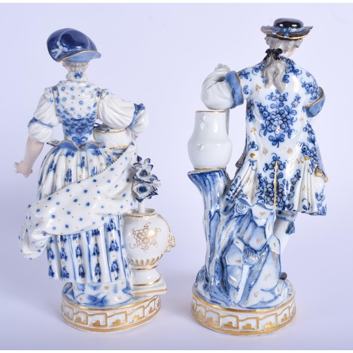 115 - A PAIR OF 19TH CENTURY MEISSEN PORCELAIN FIGURE OF A MALE AND FEMALE painted with flowers. 19 cm hig... 