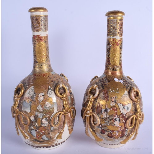 1160 - A LARGE PAIR OF 19TH CENTURY JAPANESE MEIJI PERIOD SATSUMA BOTTLE VASES AND COVERS painted with figu... 