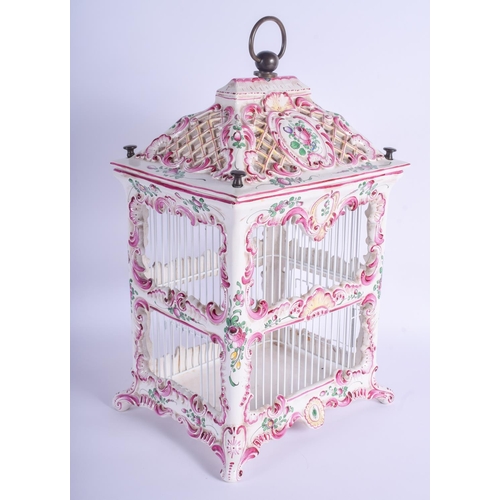 119 - A RARE EARLY 20TH CENTURY FRENCH FAIENCE POTTERY BIRD CAGE possibly Rouen, painted with floral spray... 