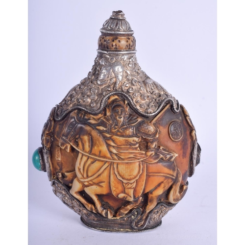 1210 - AN EARLY 20TH CENTURY TIBETAN SILVER OVERLAID SNUFF BOTTLE AND STOPPER decorated with birds and foli... 