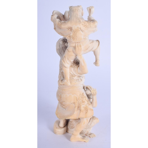 1212 - A 19TH CENTURY JAPANESE MEIJI PERIOD CARVED IVORY OKIMONO modelled as oni with two others. 14 cm hig... 