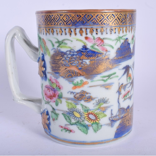 1217 - AN 18TH CENTURY CHINESE EXPORT BLUE AND WHITE MUG Qianlong, painted with landscapes. 11 cm high.